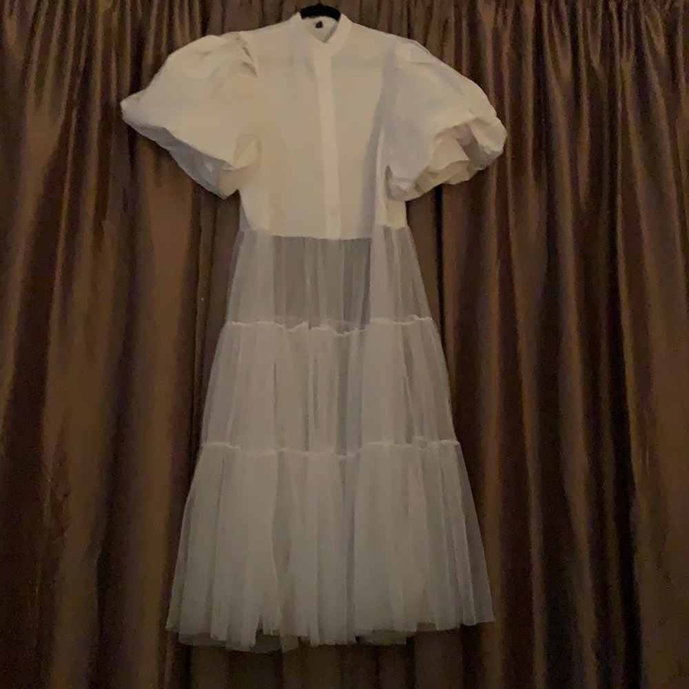 Cute white bottom down cotton top, sheer bottom.